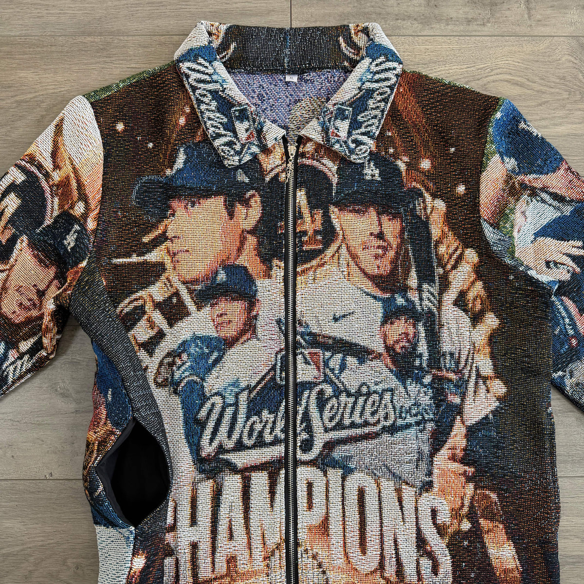 CHAMPIONS 2025 TAPESTRY TEE